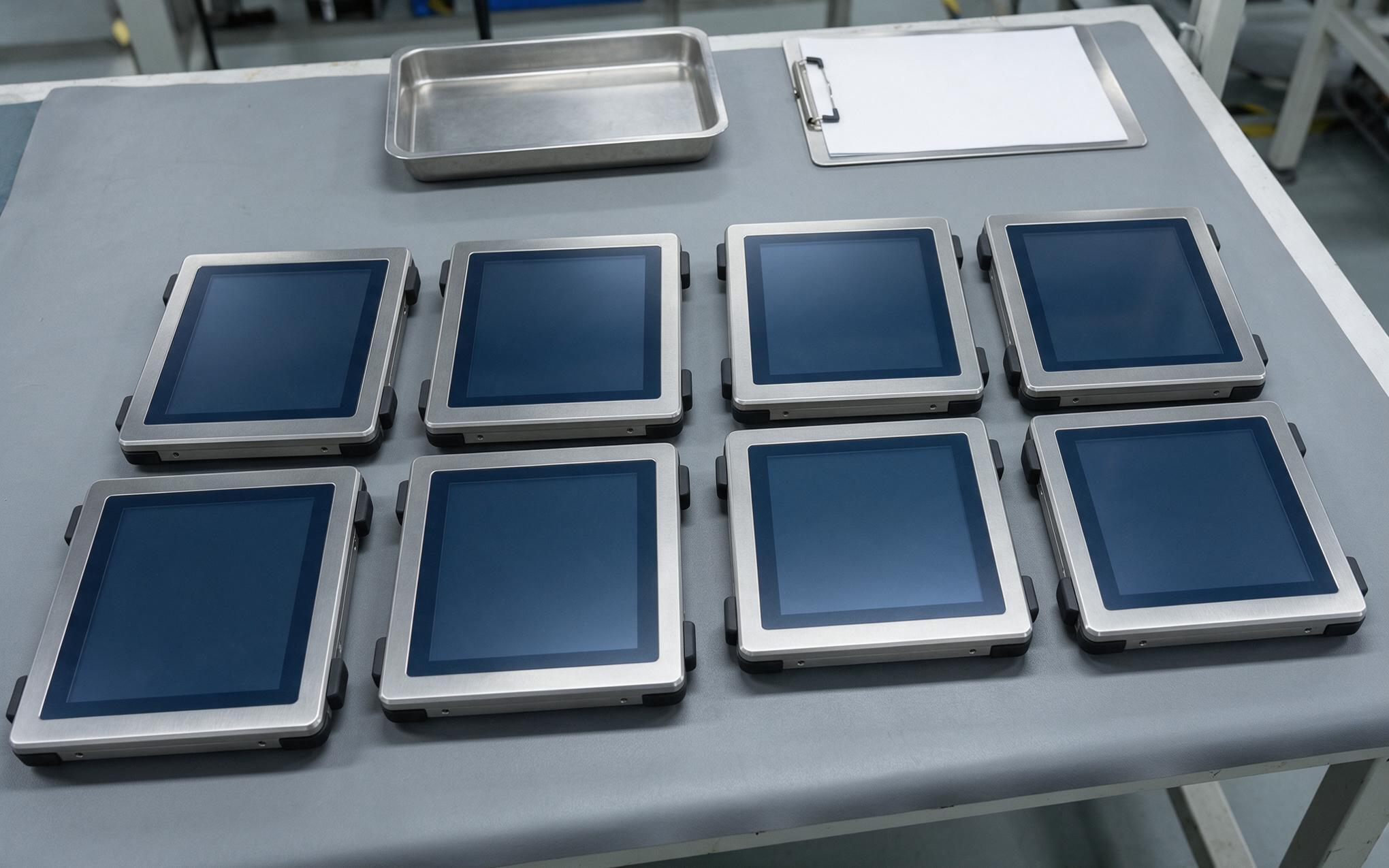 Sample units pulled from a production lot and laid out on a factory bench for attribute sampling inspection