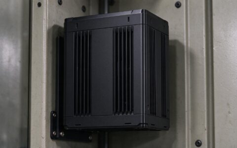 Vertical fin channels on a fanless industrial mini pc promoting chimney effect cooling